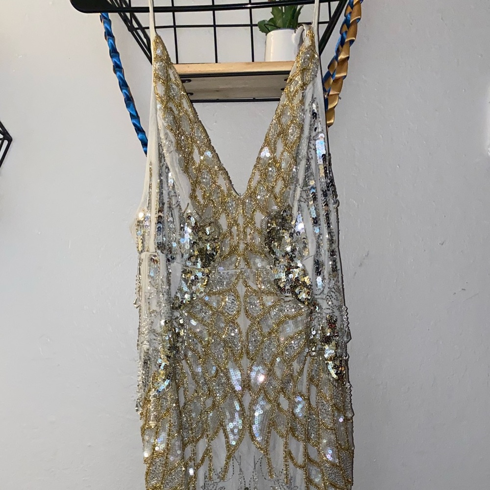 Spaghetti strap long sequin/jeweled detailed dress.